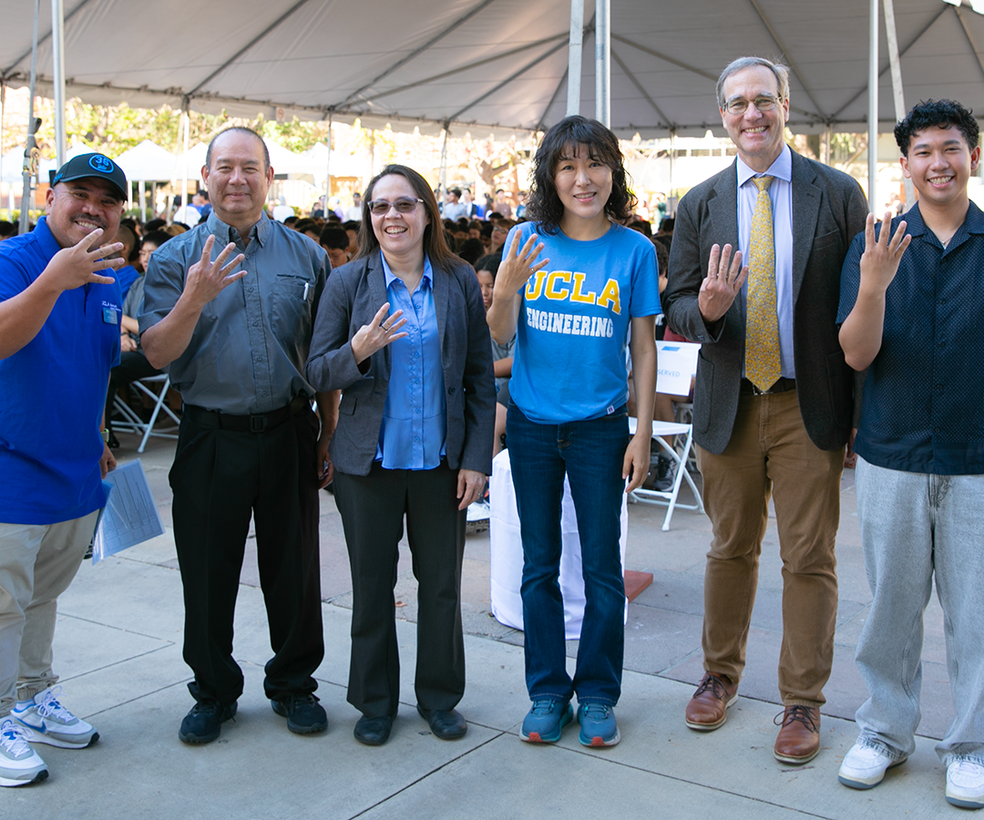 UCLA Samueli presenters show fours-up hand sign